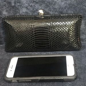 Black snakeskin clutch